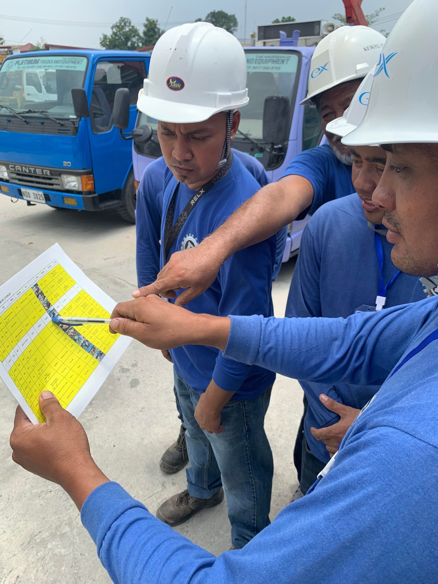 Platinum crew reviewing paperwork beside a unit