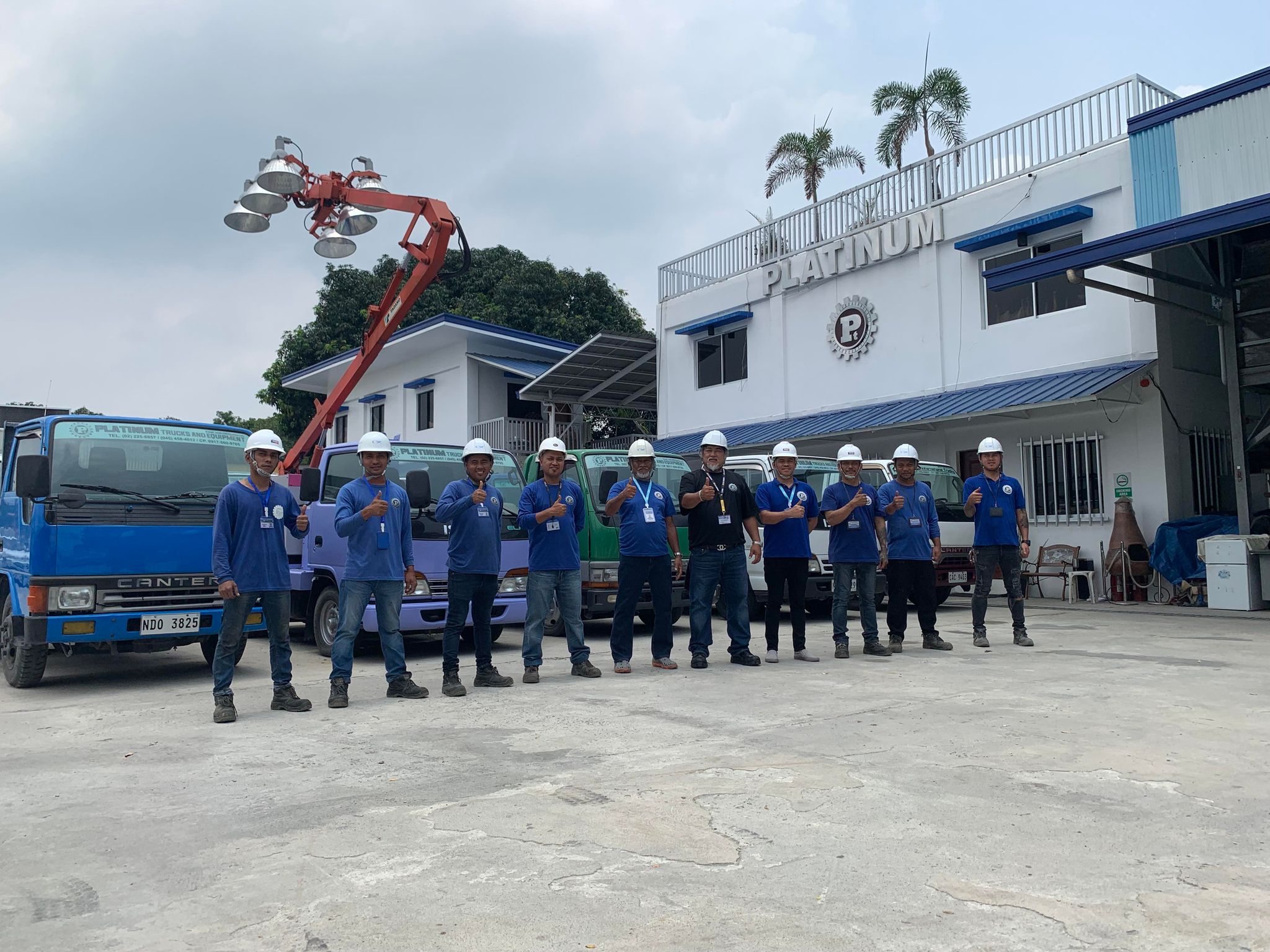 Platinum crew giving a thumbs up in the yard